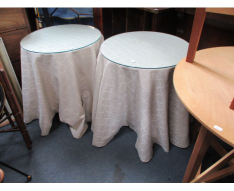 A PAIR OF 1980S COUNTRY HOUSE STYLE LAMP TABLES with floor-length cloths and circular glass tops, another pair (lacking cloth