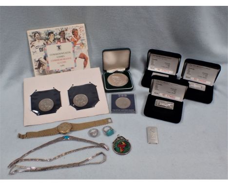 FOUR SILVER INGOTS (3 Boxed) with some commemorative coins, a rotary watch and costume jewellery 