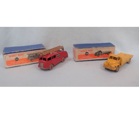 A DINKY TOYS 533 LEYLAND CEMENT WAGON AND A 555 FIRE ENGINE with extending ladder, some wear and damage to box and toys