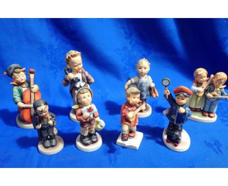 A COLLECTION OF GOEBEL FIGURES with music and profession themes