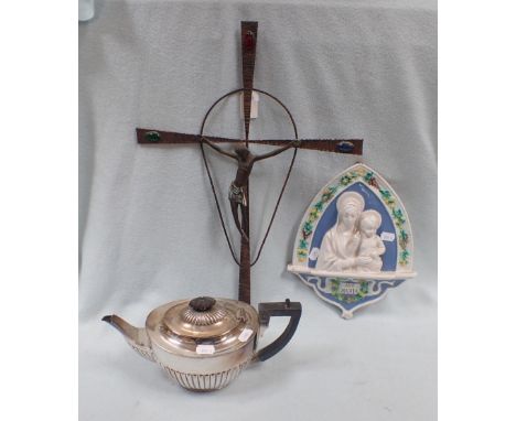 A DELLA ROBBIA STYLE MADONNA AND CHILD WALL PLAQUE with a modernist crucifix and a silver plated teapot