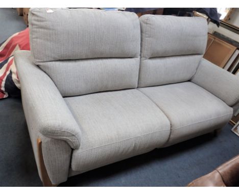 A MODERN TWO-SEATER SOFA, WITH ELECTRIC RECLINING ACTION and USB plug points 210cm cm wide, 100cm deep (untested)