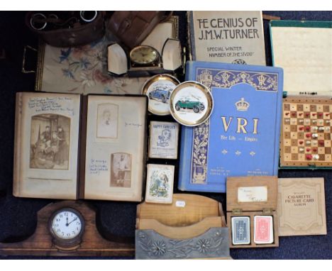 A VICTORIAN PHOTOGRAPH ALBUM, A PAIR OF BINOCULARS a 1930s traveling clock, 'Happy Families' by Jaques, 'Alice' card game by 