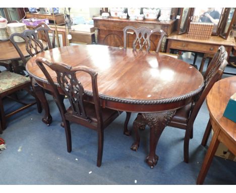 AN EDWARDIAN CHIPPENDALE REVIVAL DINING TABLE AND FOUR CHAIRS mahogany, with carved and pierced splats, carved cabriole legs,