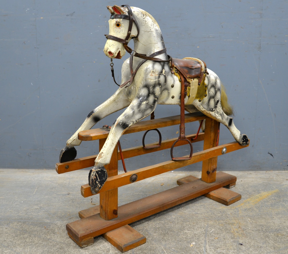 Leeway Rocking horse painted wood with leather saddle and bridle on pine stand. 90cm long 84cm hi