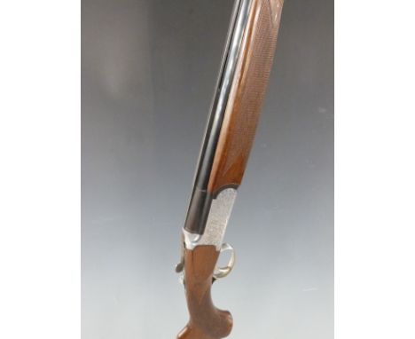 Browning Medalist Sporter 20 bore over and under shotgun with named and engraved locks, chequered semi-pistol grip and forend