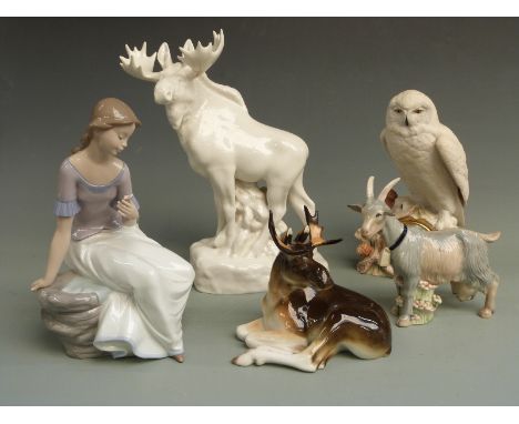 A collection of ceramics to include two Russian / Lomonosov moose figures, a Nao figure of a seated girl holding a flower, im