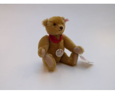 Steiff Teddy bear 100 Years of Steiff with blonde mohair, jointed limbs and ceramic pendant, limited edition 2384, 27cm tall,