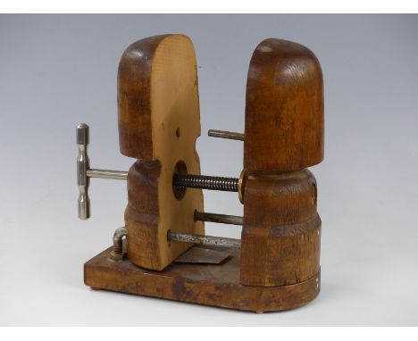 A vintage wooden hat stretcher