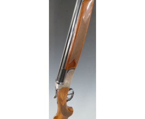 Sportam 12 bore over and under ejector shotgun with all over engraving, chequered semi-pistol grip and forend, double trigger