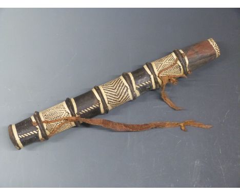 African wooden leather bound arrow quiver with woven rattan decoration and leather strap, 46cm long.&nbsp;