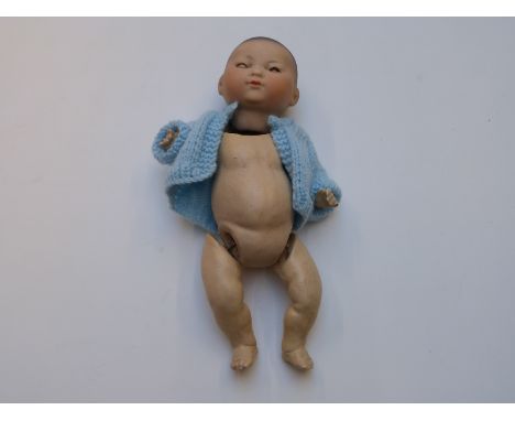 Armand Marseille Japanese bisque headed doll with closed mouth, weighted brown eyes, painted hair and jointed composite body,