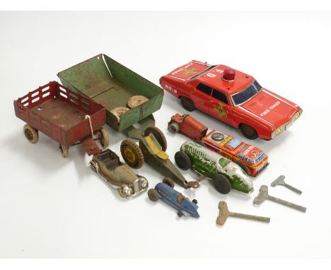 Nine tin-plate model vehicles including Tri-ang Minic, Louis Marx etc, some clockwork and some battery operated&nbsp;