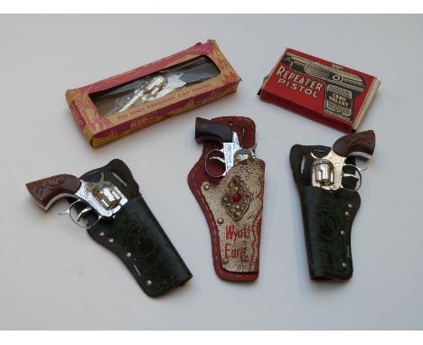 Five vintage childrens cap guns comprising The Outlaw Kid MKII 100 Shot Repeater Cap Pistol and Chad Valley Repeater Pistol, 