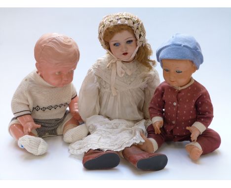 Three vintage dolls comprising a hard plastic example marked to the back K and Made in Japan, 54cm tall, another similar mark
