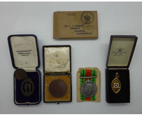 British Army WWII Defence Medal together with four shooting medals, Gloucestershire interest, three boxed