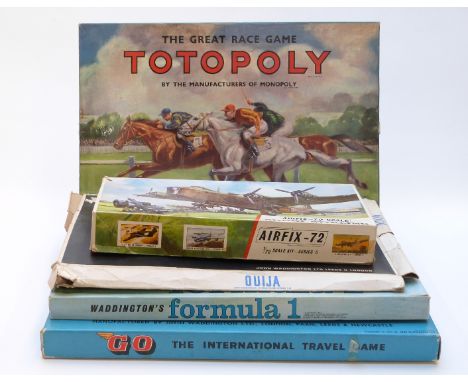 Four Waddingtons board games Totopoly, Formula 1, Go and Ouija together with an Airfix 1:72 scale Short Stirling model aeropl