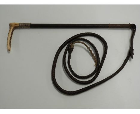 A driving whip with a hallmarked silver collar by Swaine &amp; Adeney