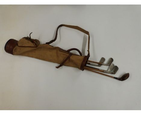 Vintage golf clubs including Spaldings Halley in canvas bag.