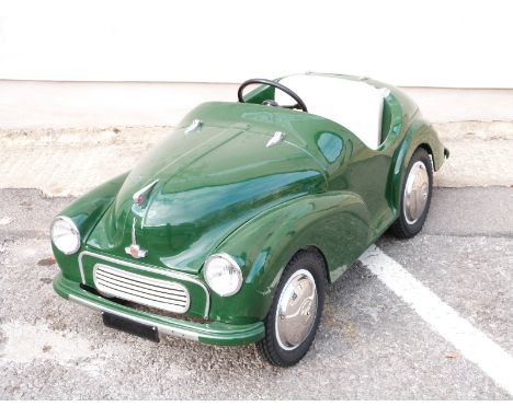 Morris 1000 Junior pedal car in green, produced by The Morris Minor Centre of Bath, with opening bonnet to reveal dummy engin