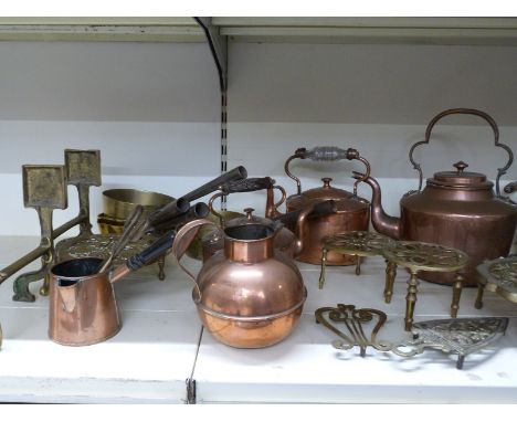A quantity of copper and brass items to include tea pots, five dogs, trivets, oil lamp etc&nbsp;