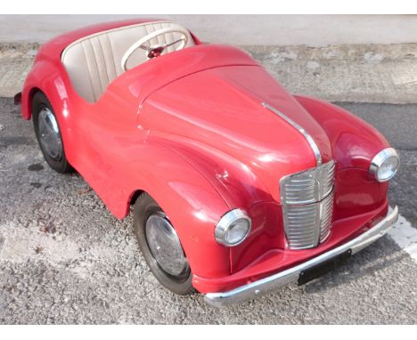 Austin Junior J-40 pedal car in red, with opening bonnet to reveal dummy engine, opening boot, treadle action pedals, 6-volt 