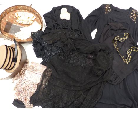 A collection of textiles to include vintage evening dresses, a silk shawl, a lace trimmed bed cover, felt hat in vintage hat 