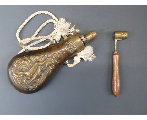 Brass powder flask with embossed decoration of dogs and birds and rope hangar (20cm long) together with a brass powder measur