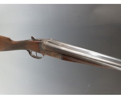 BSA 12 bore side by side shotgun with engraved lock, chequered grip and forend, double trigger and 28 inch barrels, serial nu