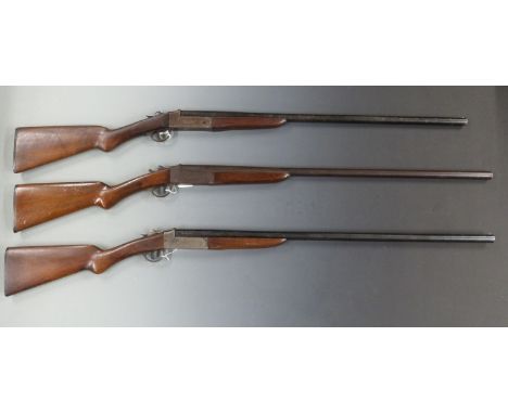 Three 12 bore single barelled shotguns&nbsp;Baikal with chequered grip and forend, sling suspension mounts and 28.5 inch barr
