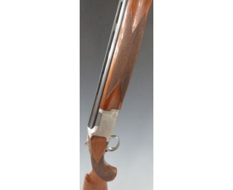 Winchester 6000 Field 12 bore over and under shotgun with engraved scenes of birds to the locks, all over scrolling engraving