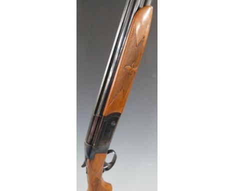 Valmet 12 bore over and under shotgun with pattern engraved locks, single trigger, chequered and patterned semi-pistol grip a