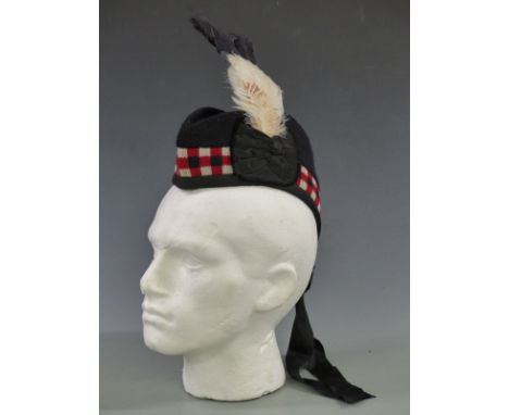 British Army Scottish Glengarry cap marked with broad arrow and 1264 to inner band, with black and white feathers