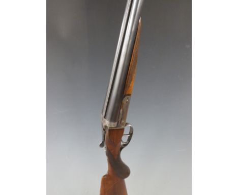 Foreign 12 bore side by side shotgun with engraved lock, top plate and thumb lever, chequered semi-pistol grip and barrels, d