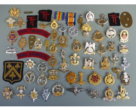 A collection of British Army cap badges, bi-metal / staybrite, including Scots Dragoon Guards, Royal Artillery, 9th/12th Lanc