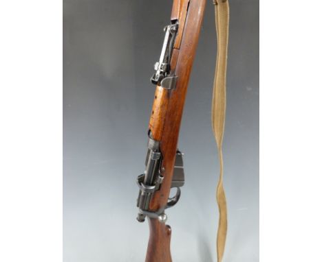 BSA Short Magazine Lee Enfield (SMLE) .303 bolt action rifle with brass oil bottle fitted in the brass butt storage compartme