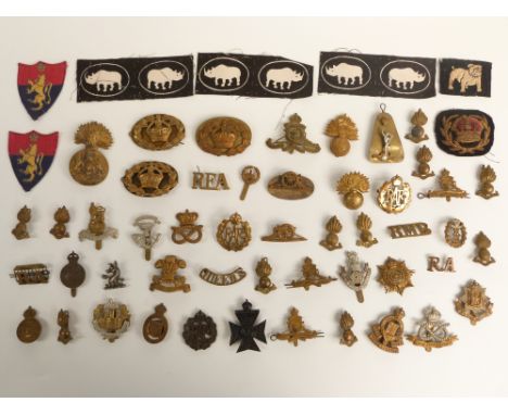 British Army collection of cap badges and rank badges including Cheshire Yeomanry, The Loyal Regiment, Essex Regiment, East S