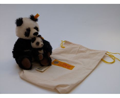 Two Steiff Teddy bears Panda Pair with black, white and brown mohair, 22cm tall, in original cloth bag