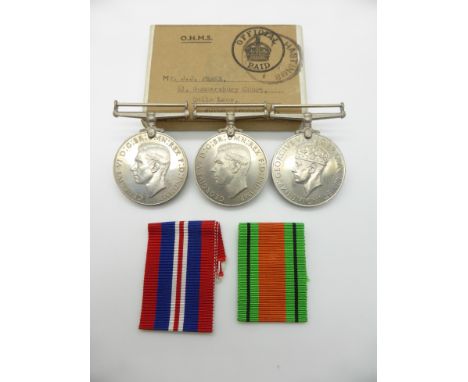 British Army WWII medals comprising War Medal and two Defence Medals in O.H.M.S box addressed to Mr. J.J. Peake, Acton, Londo