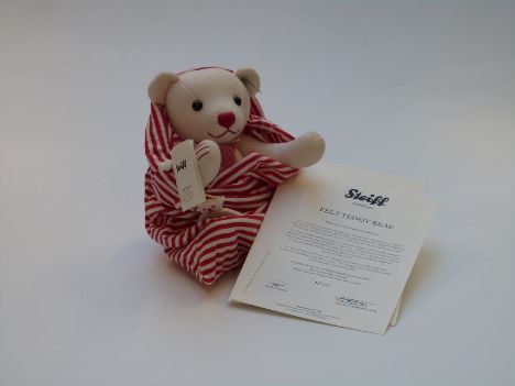Steiff felt Teddy bear with white felt body, red and white striped scarf and jointed limbs, limited edition 503/2000, in orig
