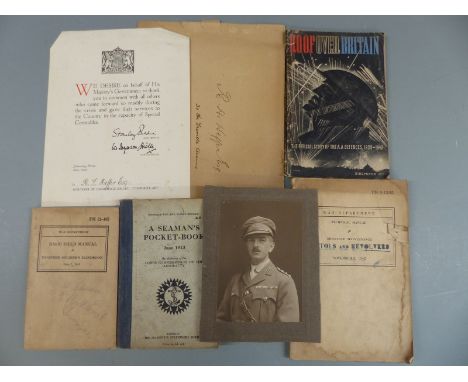 A quantity of military booklets including 1942 pistols and revolvers, basic field manual and a letter to R L Heffer Esq of th