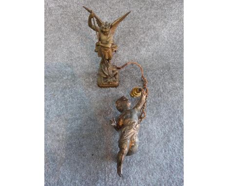 A hanging gilded cherub light fitting with chain and a gilded cast metal statue of San Miguel Archangel. Writing to base. Tal