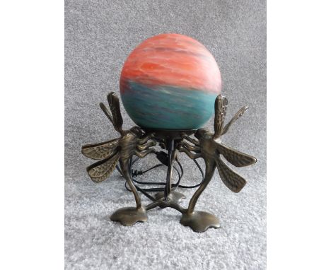 An Art Deco brass dragonfly lamp with orange and turquoise marbled blown frosted glass globe shade. H 27cm. 