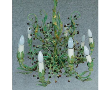 A decorative painted metal ten branch ceiling chandelier of scrolling leaf and fruit naturalistic form. 70x65cm 