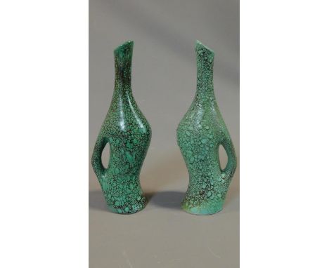 A pair of ceramic turquoise glazed jugs. Marked to the bottom CAR. H.35cm 