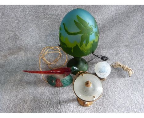 A collection of four vintage lamps. One Galle style cameo glass dragonfly lamp, moulded opalescent foliate desk lamp, painted