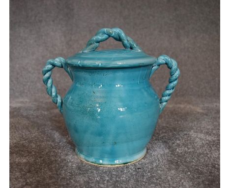 A Persian glazed ceramic blue pot with lid. H.20cm x W.18cm 