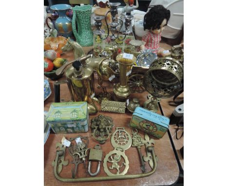 A selection of brass wares including figures door knocker and AA badge