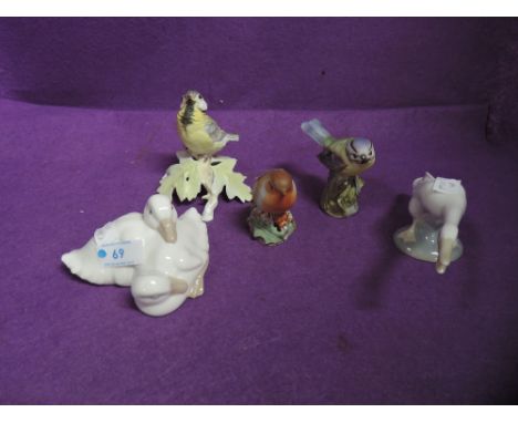 A Lladro study, Swan, Nao study, Ducklings and two Royal Worcester studies, Fledgling Great Tit and Robin