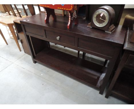 A modern dark stained console table